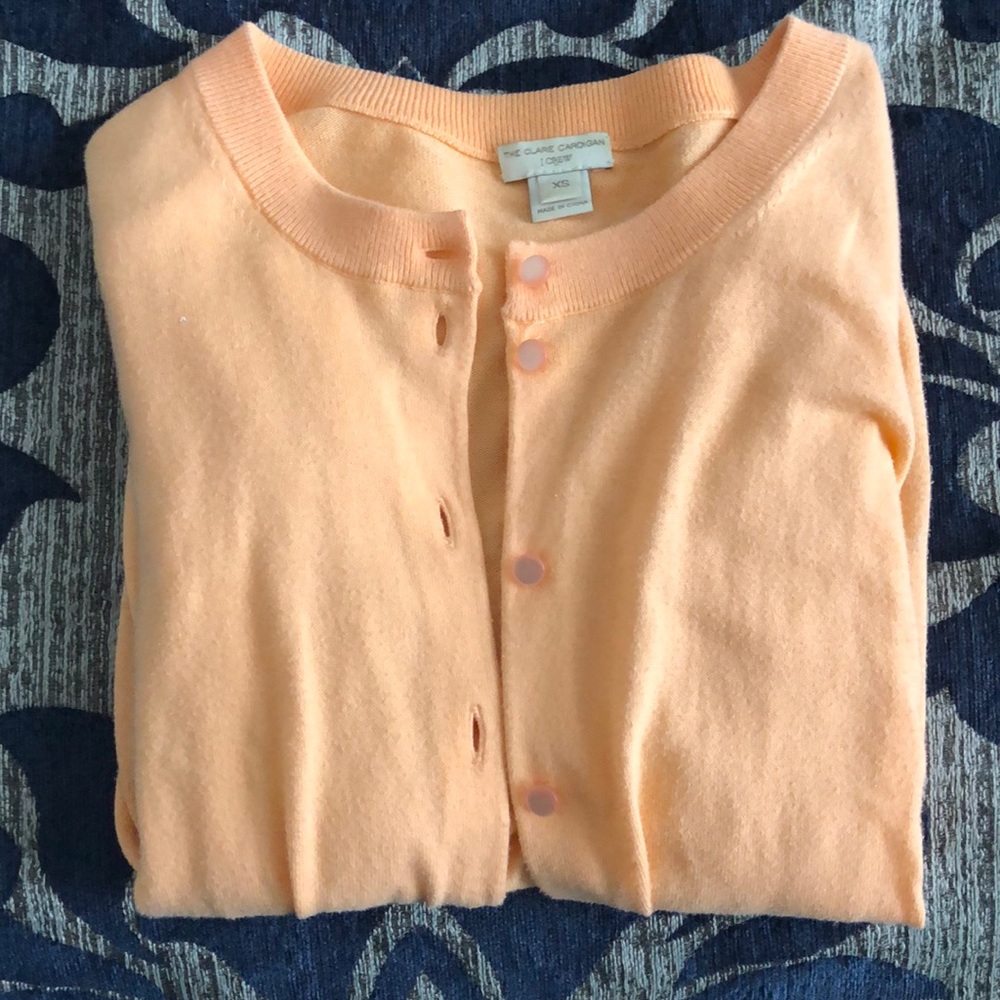 light orange cardigan
